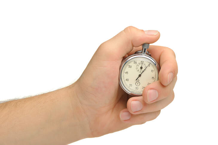 Man's hand with a stop watch. It is isolated on a white background